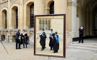 File photograph shows graduates queueing to have their photograph taken after a graduation ceremony at Oxford University in Engl