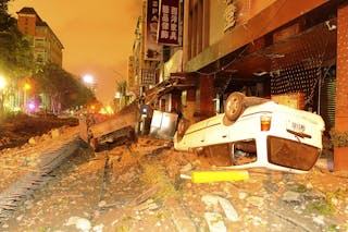 Wreckage of vehicles are seen amongst debris after an explosion in Kaohsiung