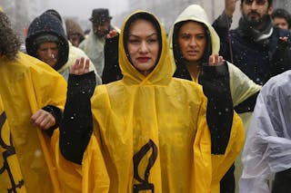 Members of Amnesty International USA march across the Brooklyn bridge demanding police accountability, in New York
