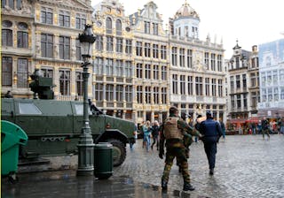 A Belgian soldier patrols on Brussels Grand Place in central Brussels after security was tightened in Belgium following the fata