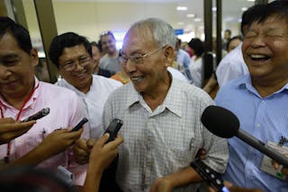 Brigadier General Thein Swe speaks to the media as he arrives at Yangon domestic airport, after being released from a prison nea
