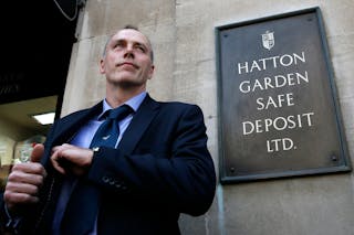 Detective Chief Inspector Paul Johnson of the Flying Squad stands outside a safe deposit building on Hatton Garden in central Lo