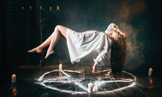 Young woman in white shirt flying over pentagram circle, gark magic, sacrificial ritual. Occultism and exorcism — Photo by Nomad