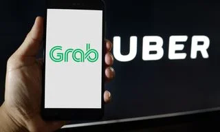 Uber和Grab標誌。