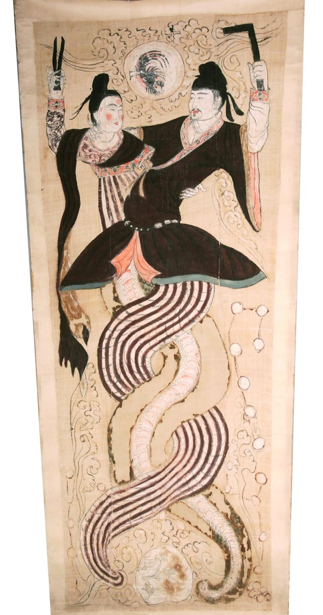 新疆吐魯番阿斯塔那77號墓出土的《伏羲女媧圖》。（新疆維吾爾自治區博物館藏）